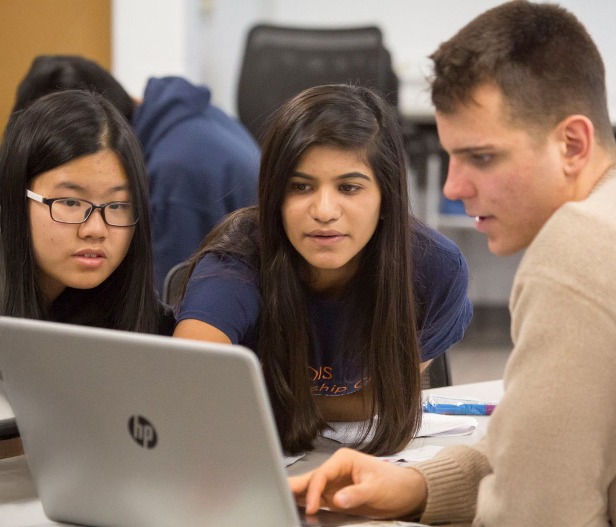Student working with syringe and test tube in lab