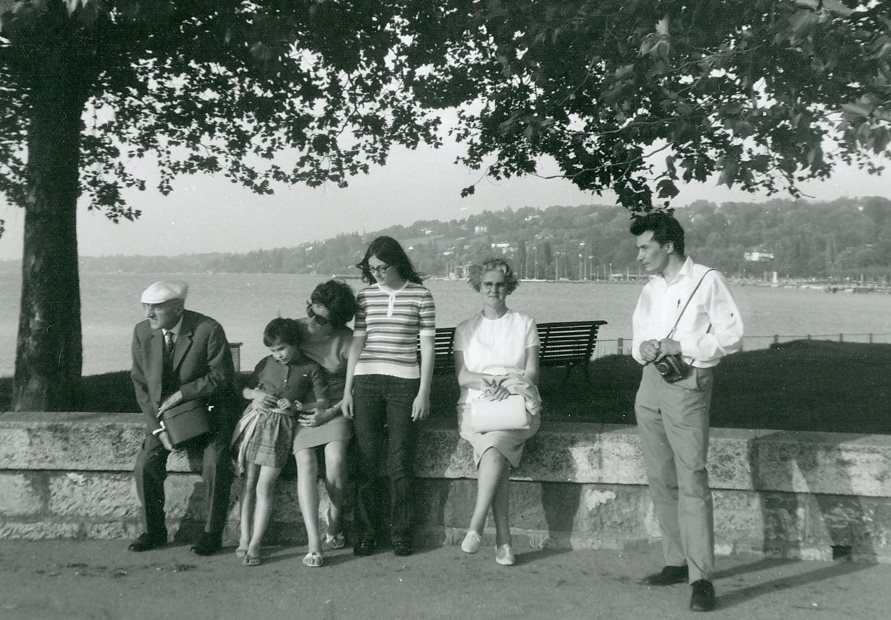 A group of people sitting on a stone ledgeAI-generated content may be incorrect.