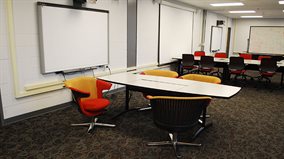 The new interaction room contains two Smartboards, plus a place to plug in at every seat