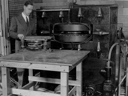 Donald Kerst with the original table-top betatron and a 25-MeV version.