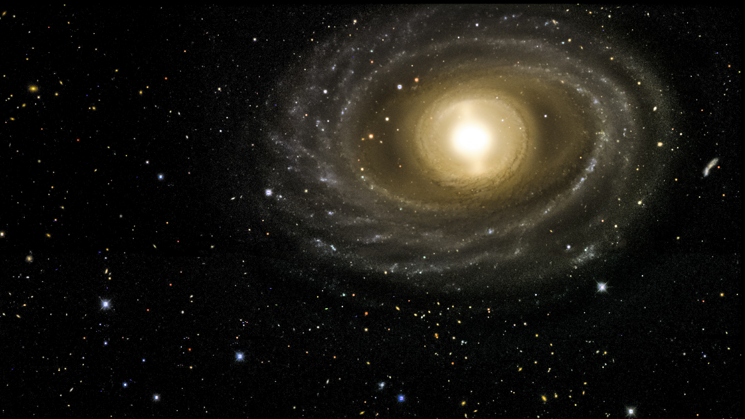 This image of the NGC 1398 galaxy was taken with the Dark Energy Camera. This galaxy lives in the Fornax cluster, roughly 65 million light years from Earth. It is 135,000 light years in diameter, just slightly larger than our own Milky Way galaxy, and contains more than a hundred million stars. Credit: Dark Energy Survey.