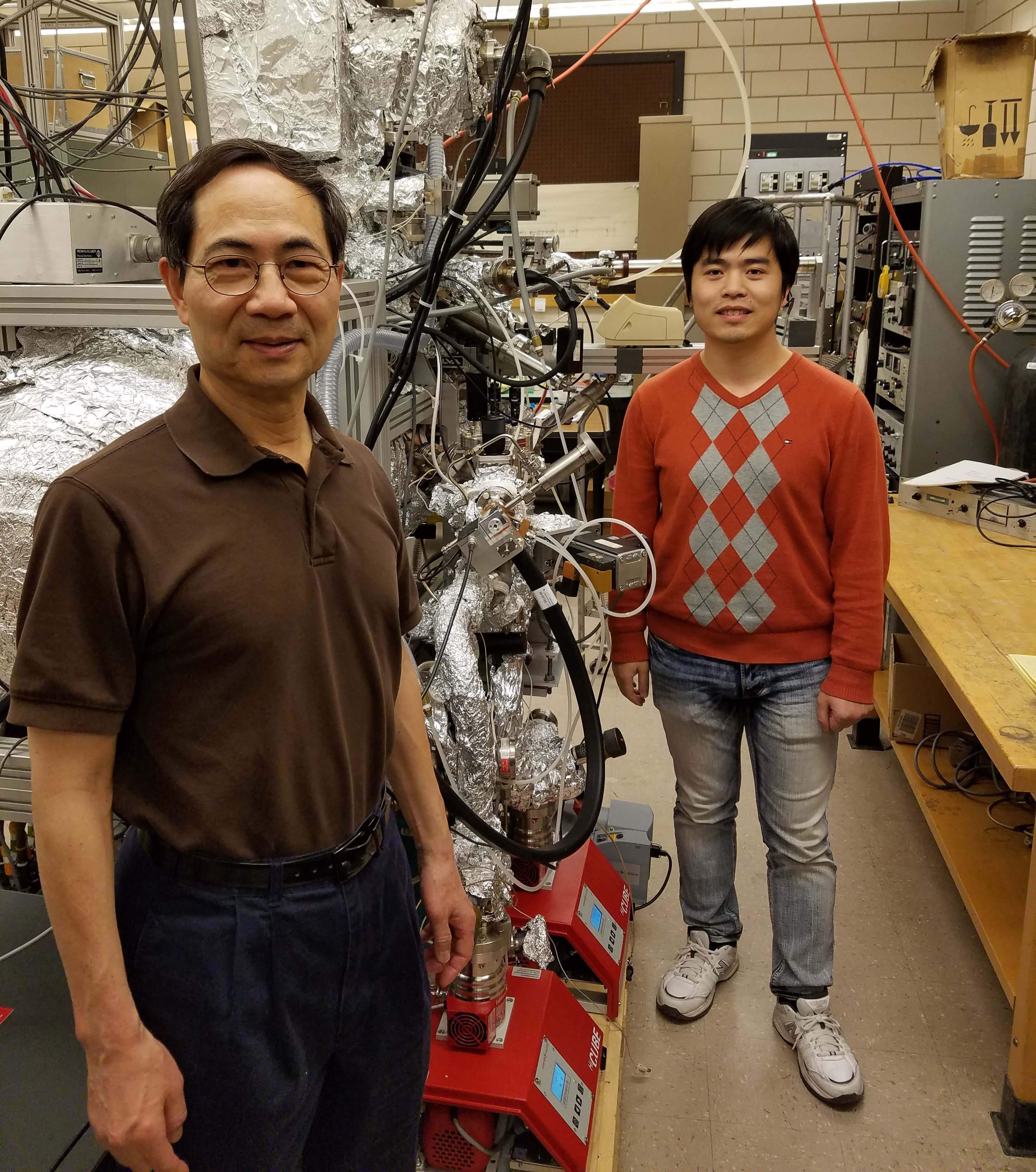 Physics Professor Tai-Chang Chiang and graduate student Caizhi Xu pose in Chang's laboratory at the Frederick Seitz Materials Research Lab at the University of Illinois at Urbana-Champaign. Image courtesy of Physics Illinois.