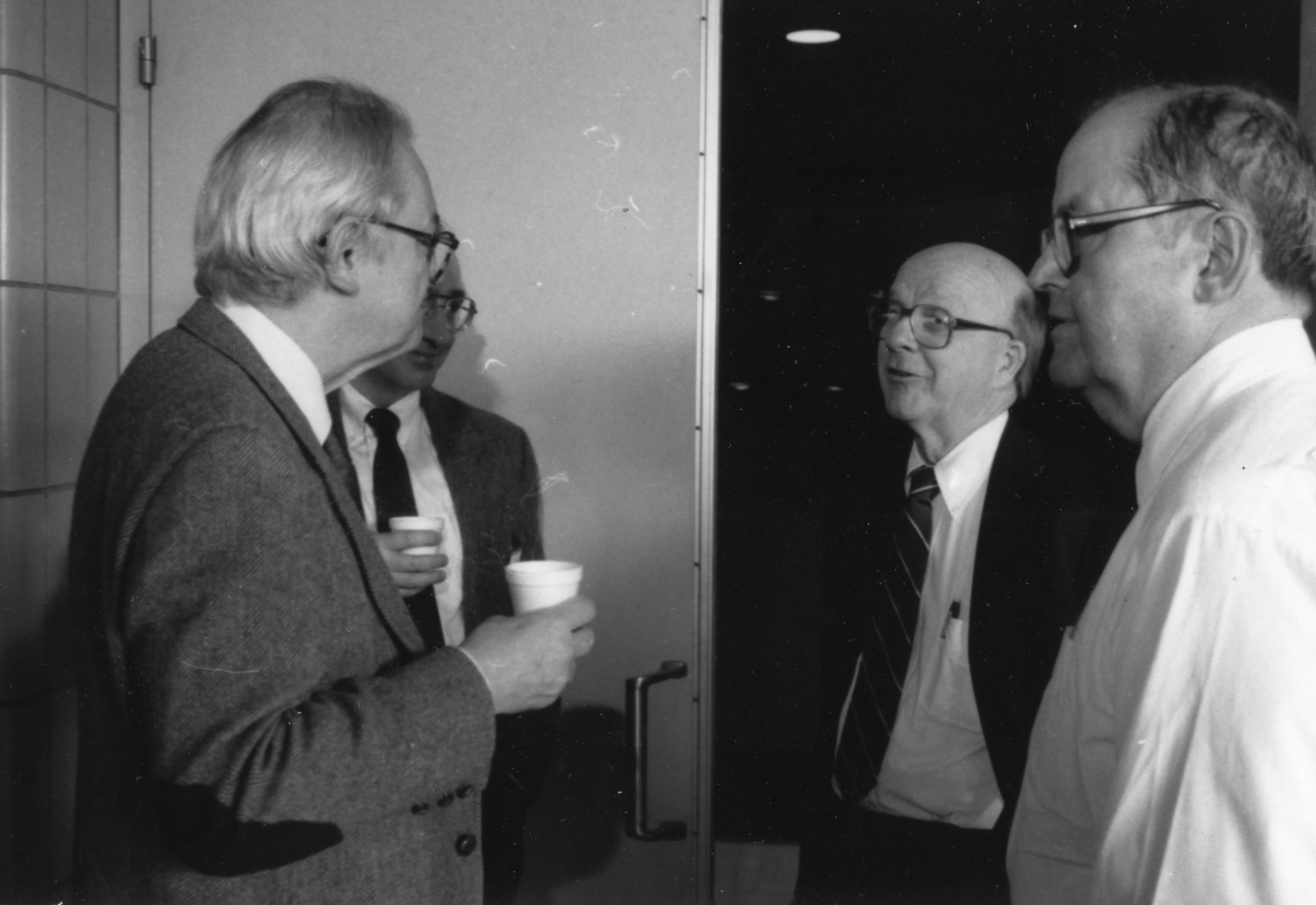 L-R: Charles Slichter, David McCall, and William Slichter (Charles' brother) converse at meeting, undated. Department of Physics, University of Illinois at Urbana-Champaign, courtesy of Emilio Segr&egrave; Visual Archives of the American Institute of Physics