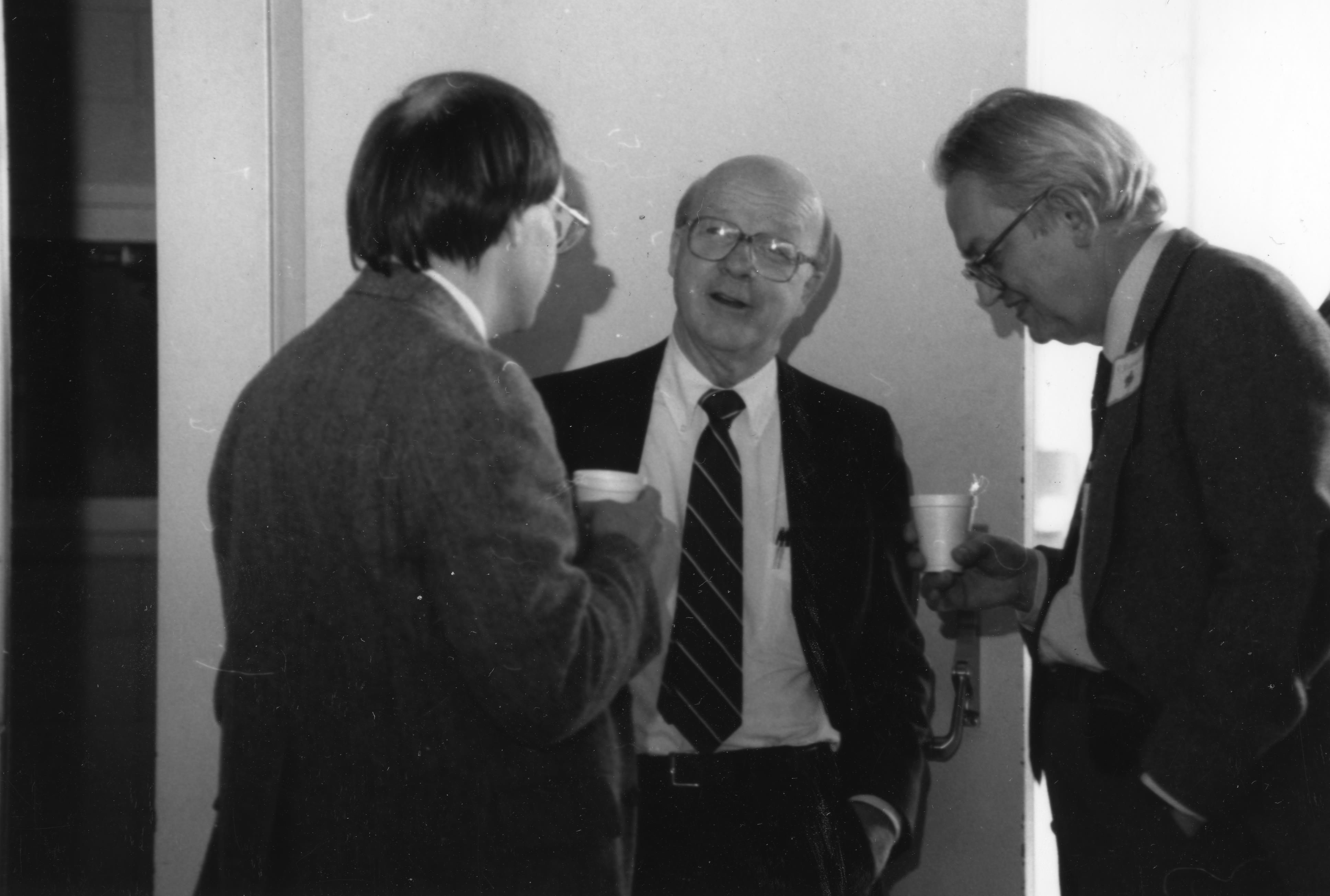 L-R: Unknown, David McCall and Charles Slichter converse, undated. Department of Physics, University of Illinois at Urbana-Champaign, courtesy of Emilio Segr&egrave; Visual Archives of the American Institute of Physics