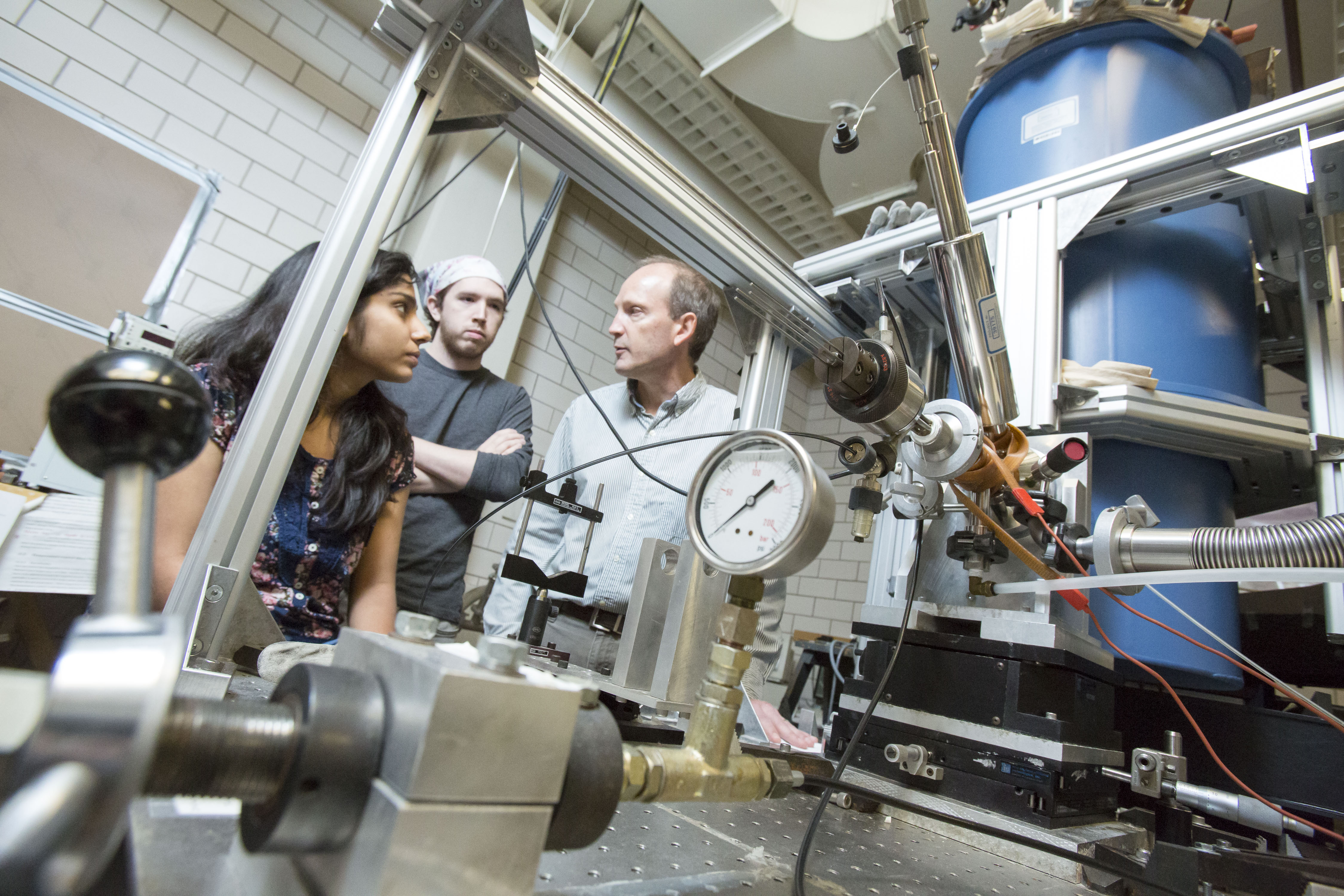 Cooper works with graduate students in one of his labs.