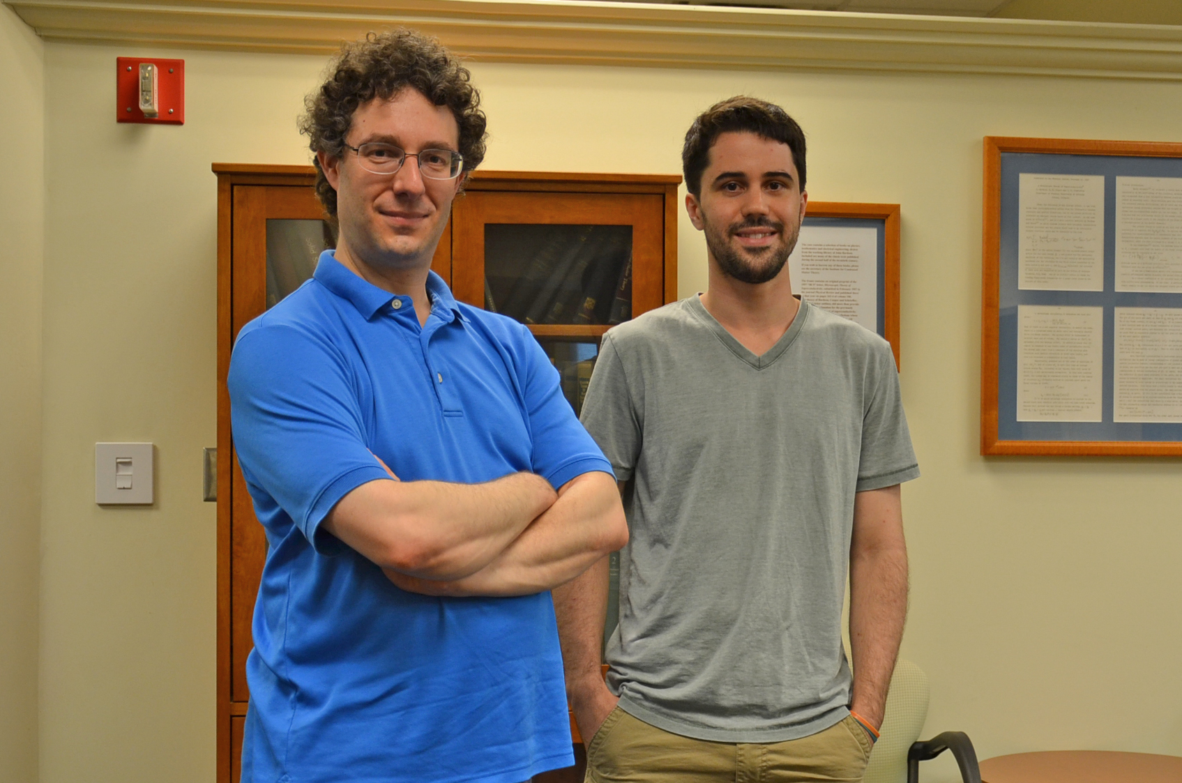 Professor Bryan Clark and graduate student Eli Chertkov pose in the common room of the Institute for Condensed Matter Theory. Photo by Siv Schwink, Department of Physics, University of Illinois at Urbana-Champaign