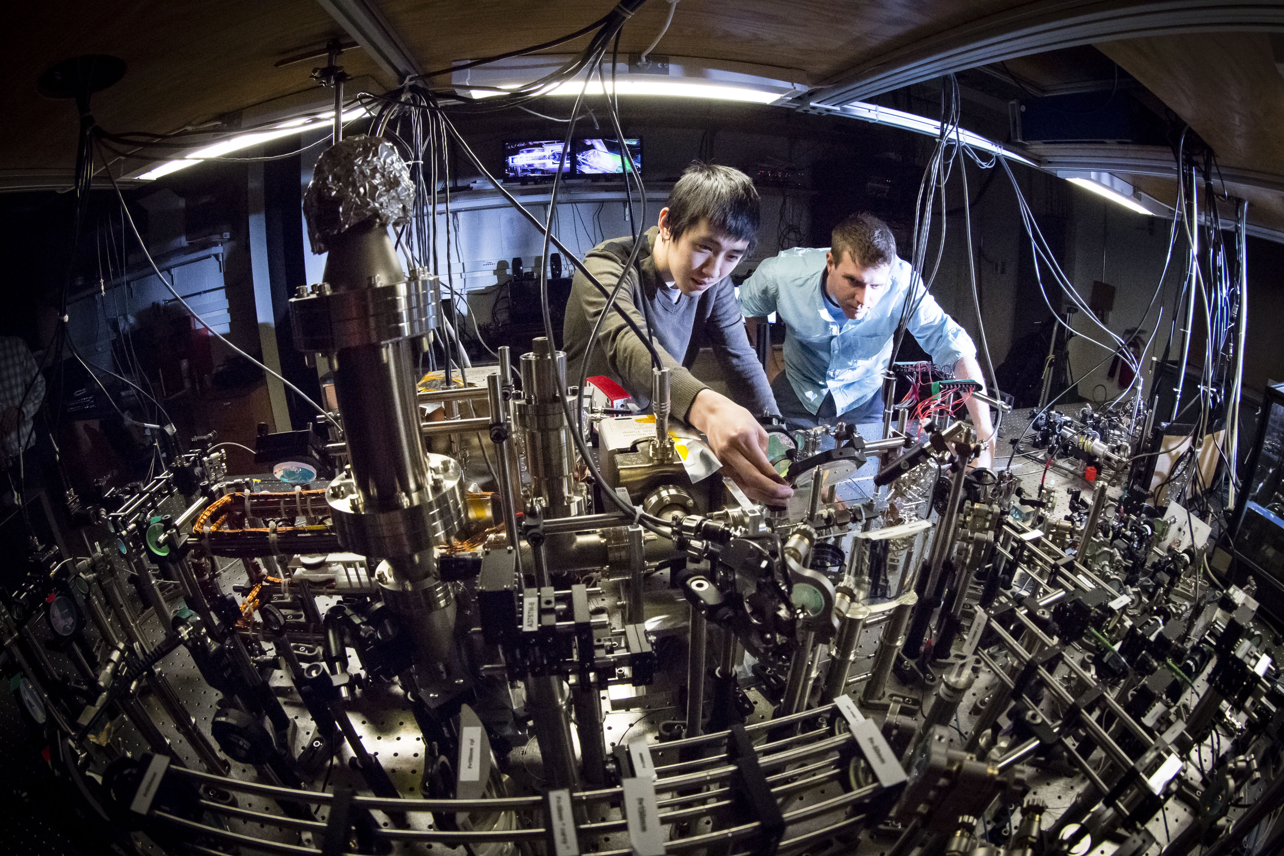 University of Illinois Professor of Physics Bryce Gadway (right) and graduate student Fangzhao Alex An build a quantum simulation experiment at Loomis Laboratory of Physics in Urbana, Illinois. Photo by L. Brian Stauffer, University of Illinois at Urbana-Champaign