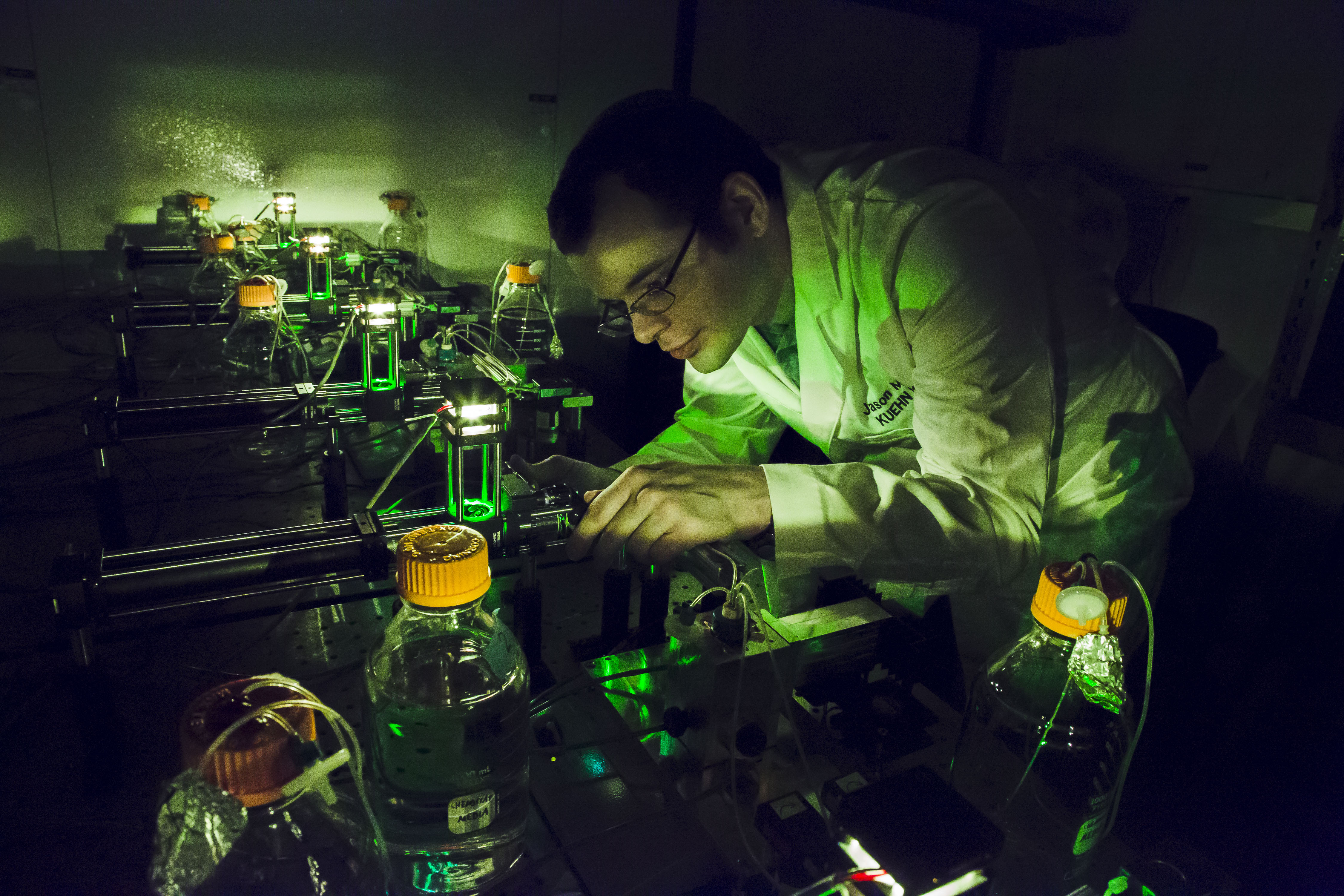 Physics graduate student Jason Merritt works on his automated bacterial population sampling device in the Kuehn Lab at the Loomis Laboratory of Physics in Urbana. Photo by L. Brian Stauffer, University of Illinois at Urbana-Champaign