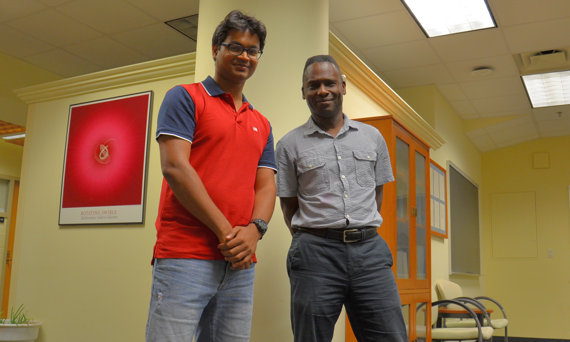 University of Illinois at Urbana-Champaign Professor of Physics Philip Phillips (right) and graduate student Bikash Padhi pose in the Institute for Condensed Matter Theory on the Urbana campus. Credit: Siv Schwink, University of Illinois at Urbana-Champaign