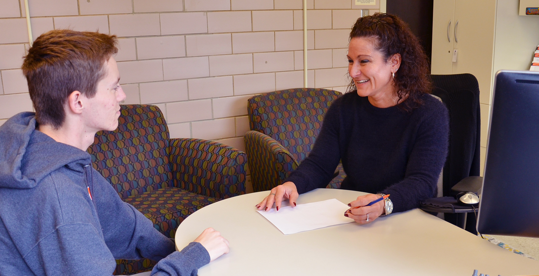 Illinois Physics Senior Academic Advisor Merissa Jones meets with a student in her office in Loomis Lab.