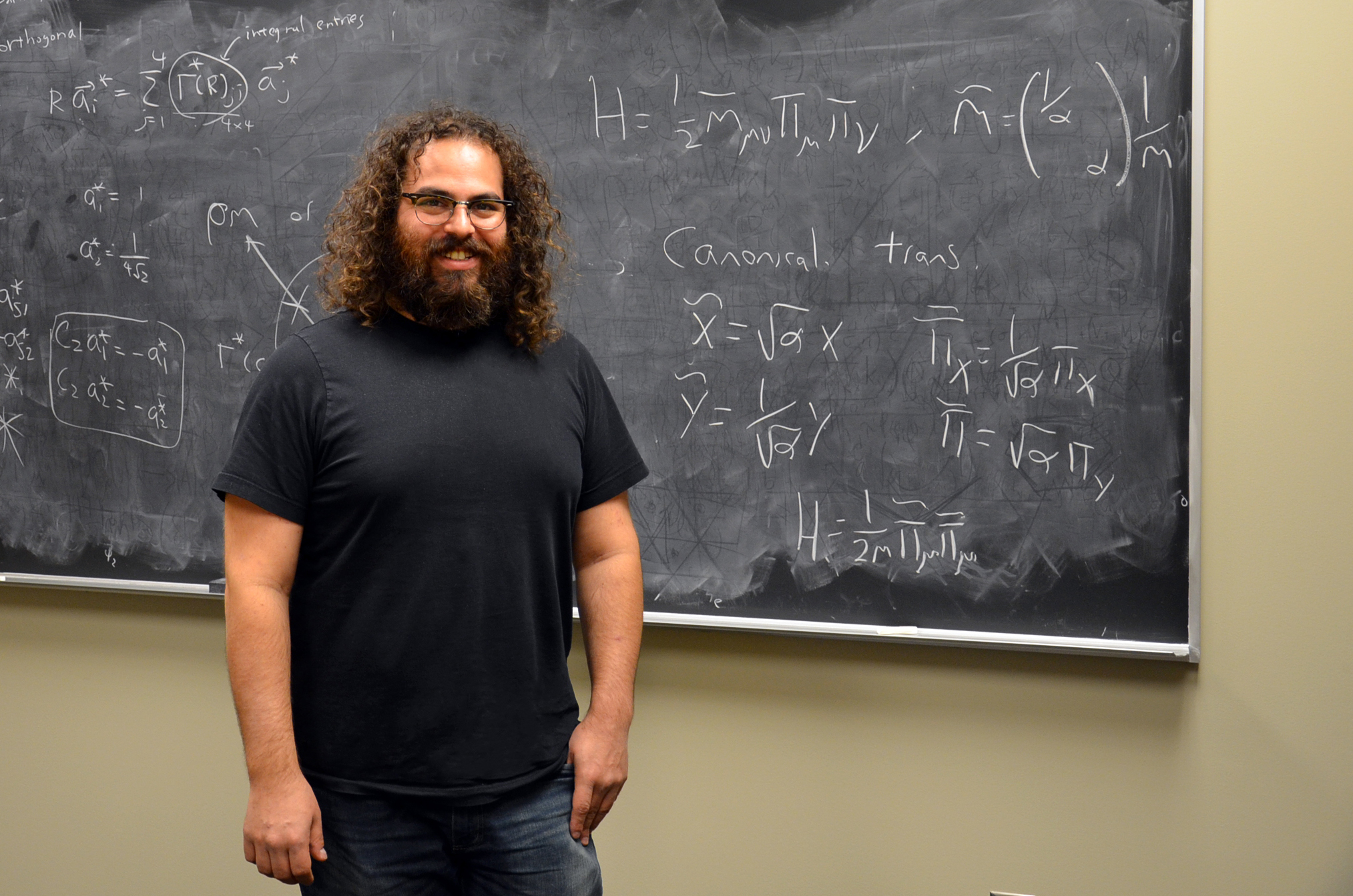 University of Illinois Physics Professor Barry Bradlyn poses in his office at the Institute for Condensed Matter Theory on the Urbana campus. Photo by Siv Schwink for Illinois Physics