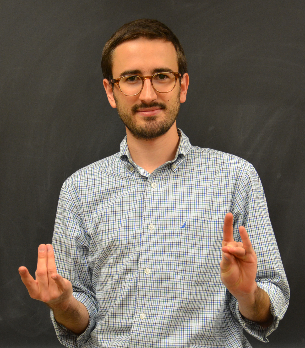 Illinois Physics graduate student Colin Lualdi signs 'cat state,' one of many physics-specific signs he co-developed.