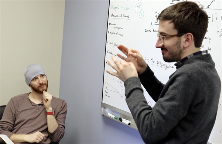 Illinois Physics graduate student Colin Lualdi works with colleague David Spiecker during an ASL Clear development session at the Center for Research and Training at the Learning Center for the Deaf in Framingham, MA. Photo by Jonah Meehan, Center for Research and Training