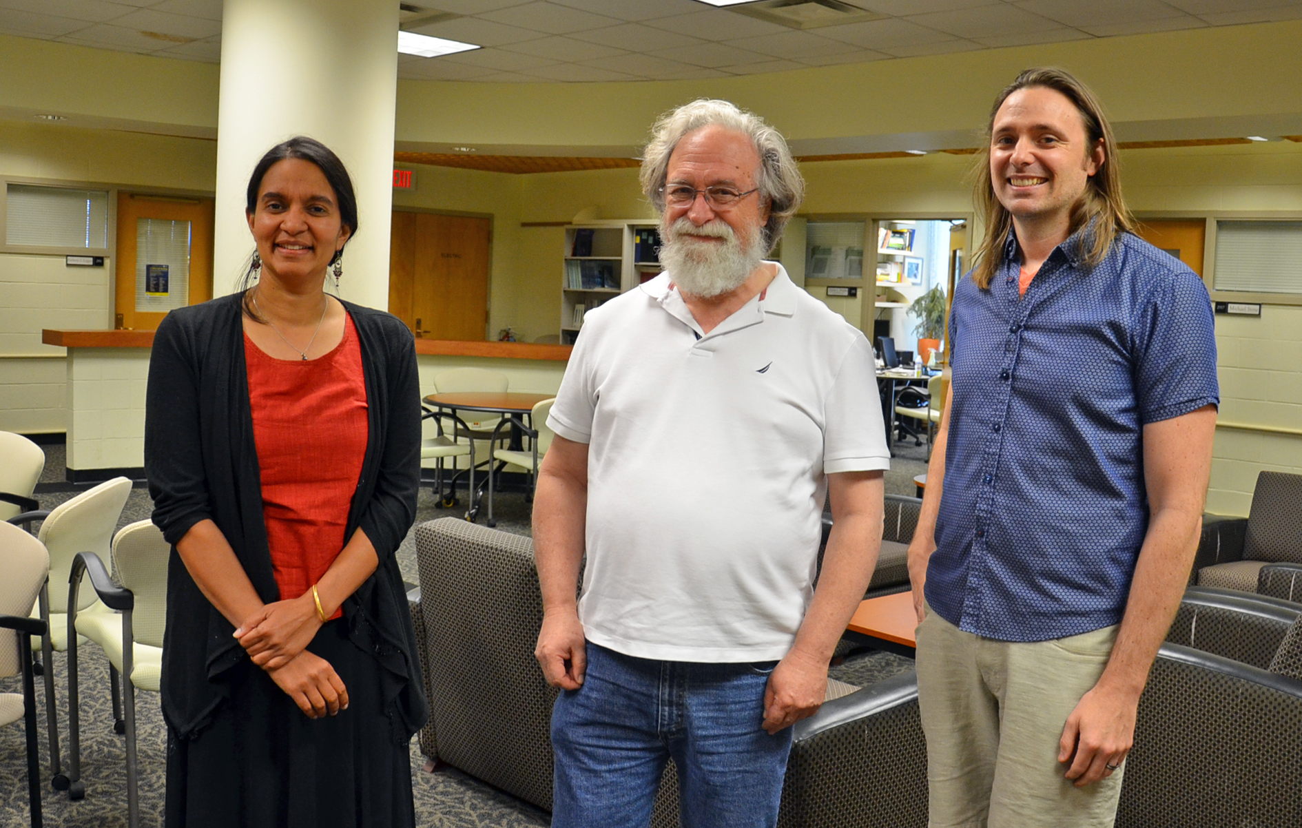 (L-R) Illinois Physics Professors Smitha Vishveshwara, Eduardo Fradkin, and Taylor Hughes pose in the common room of the Institute for Condensed Matter Theory (ICMT) in Urbana. Vishveshwara and Hughes are co-PI and PI respectively on the Moore Foundation grant; Fradkin is the the director of the ICMT. Photo by Siv Schwink for Illinois Physics