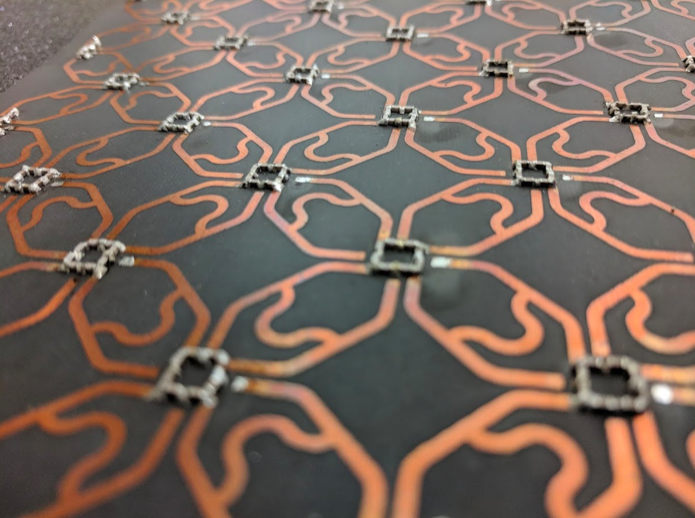 Photograph of the 4-fold symmetric topological circuit used in this study. Image courtesy of Bahl, Hughes, et al., University of Illinois at Urbana-Champaign