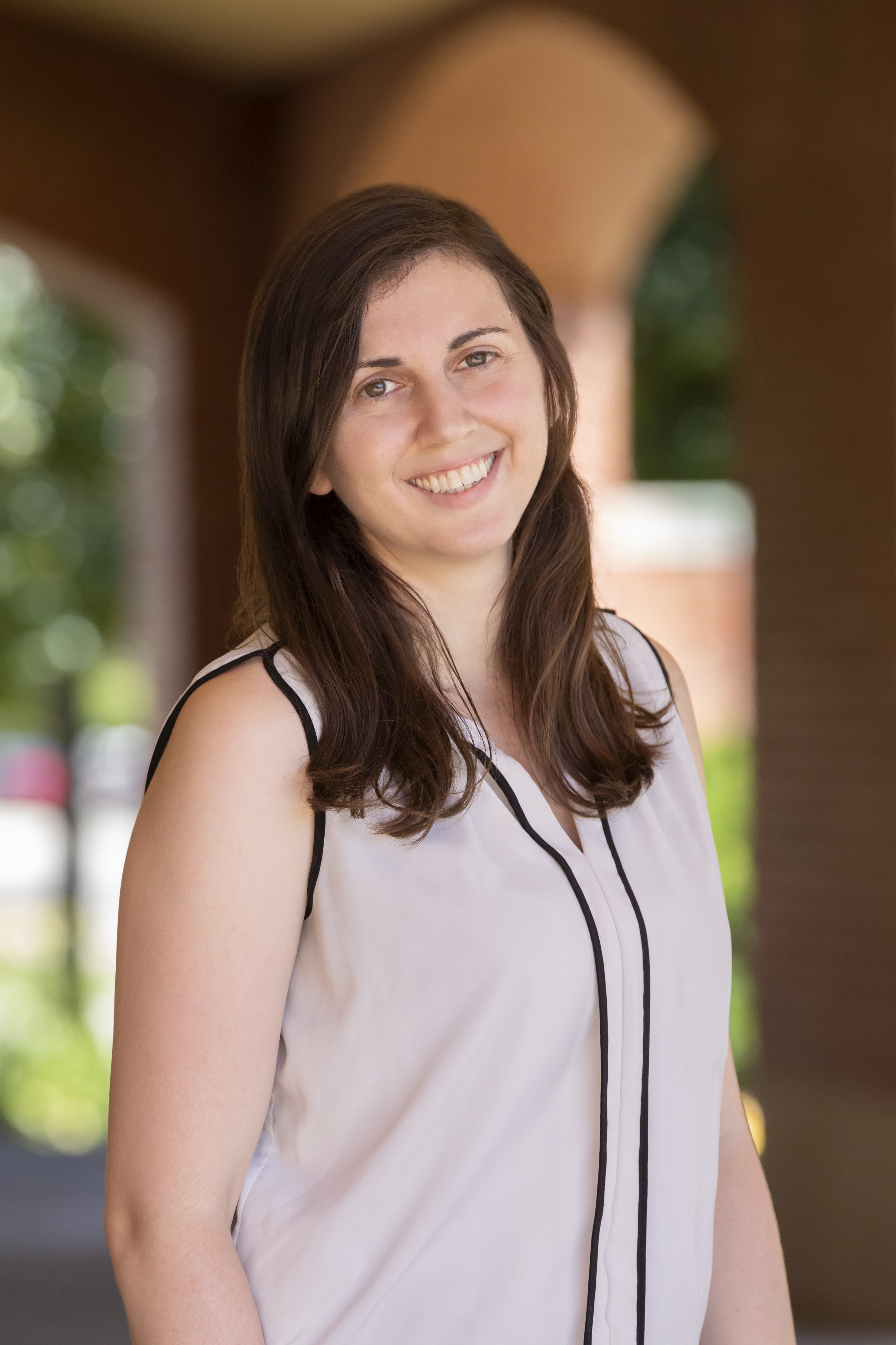 Maggie Mahmood, the University of Illinois Physics Department's secondary education partnership coordinator, stands in front of the Grainger Engineering Library on the Urbana campus. Photo by L. Brian Stauffer, University of Illinois at Urbana-Champaign