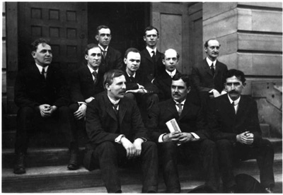 First row: Ernest Rutherford, department head Albert P. Carman, Charles T. Knipp. Middle row: A.H. Sluss, Fay C. Brown, C.S. Hudson, Floyd R. Watson, and W.F. Schultz. Back row: M. Case and W. Stempel