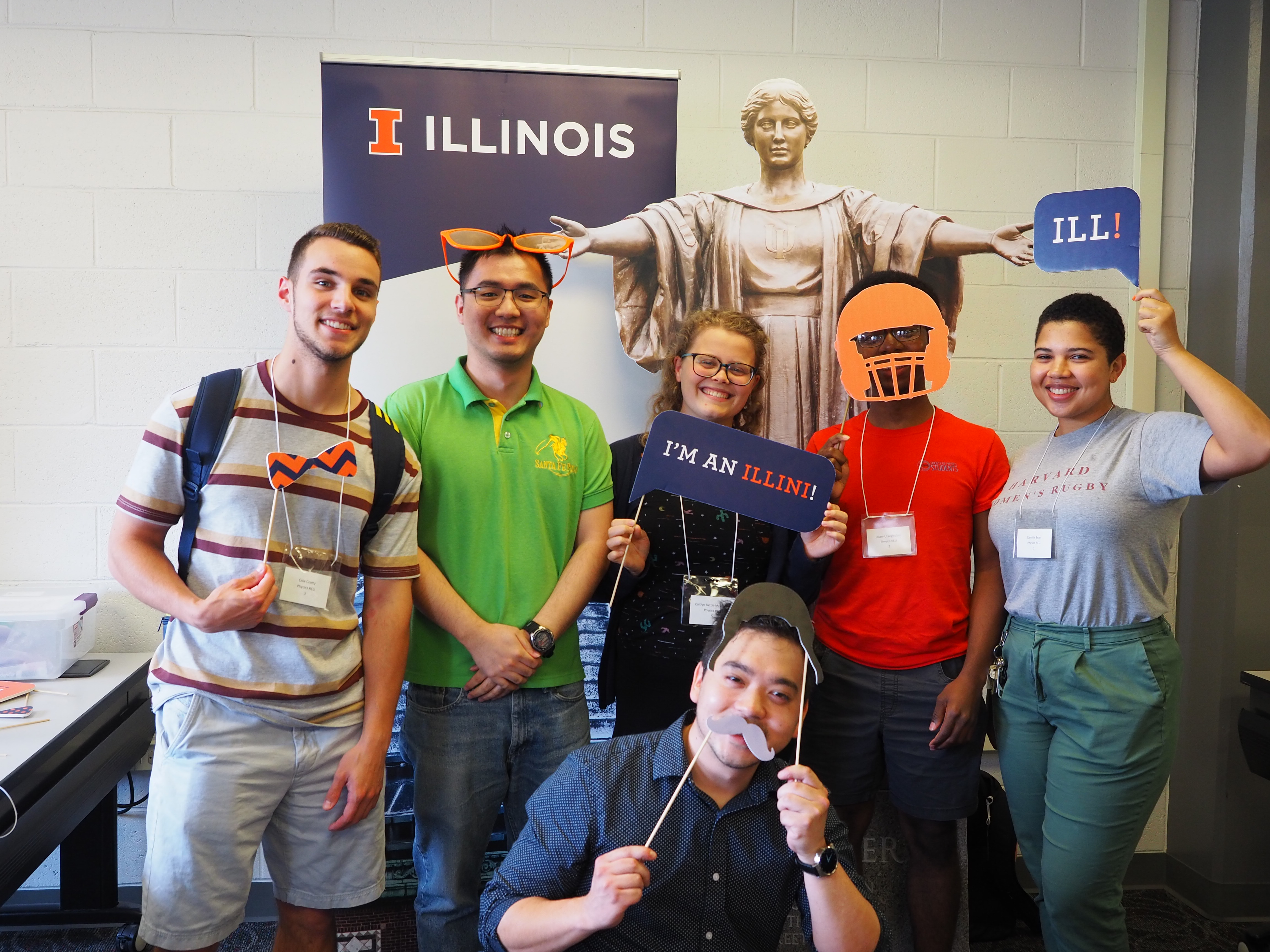 During the first week, we co-host an annual REU Ice Cream Welcome Social for many Grainger College of Engineering's summer research students. Here, Physics REU students: Cole, JiaZhao, Cait, Hilary, and Camille and REU program coordinator Patrick Snyder pose with Alma during the Ice Cream social.