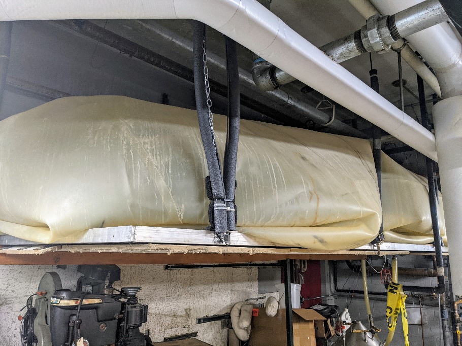 The helium recovery bag in the basement of Loomis Lab collects recovered gas after it has passed through one of the diaphragm gas meters.