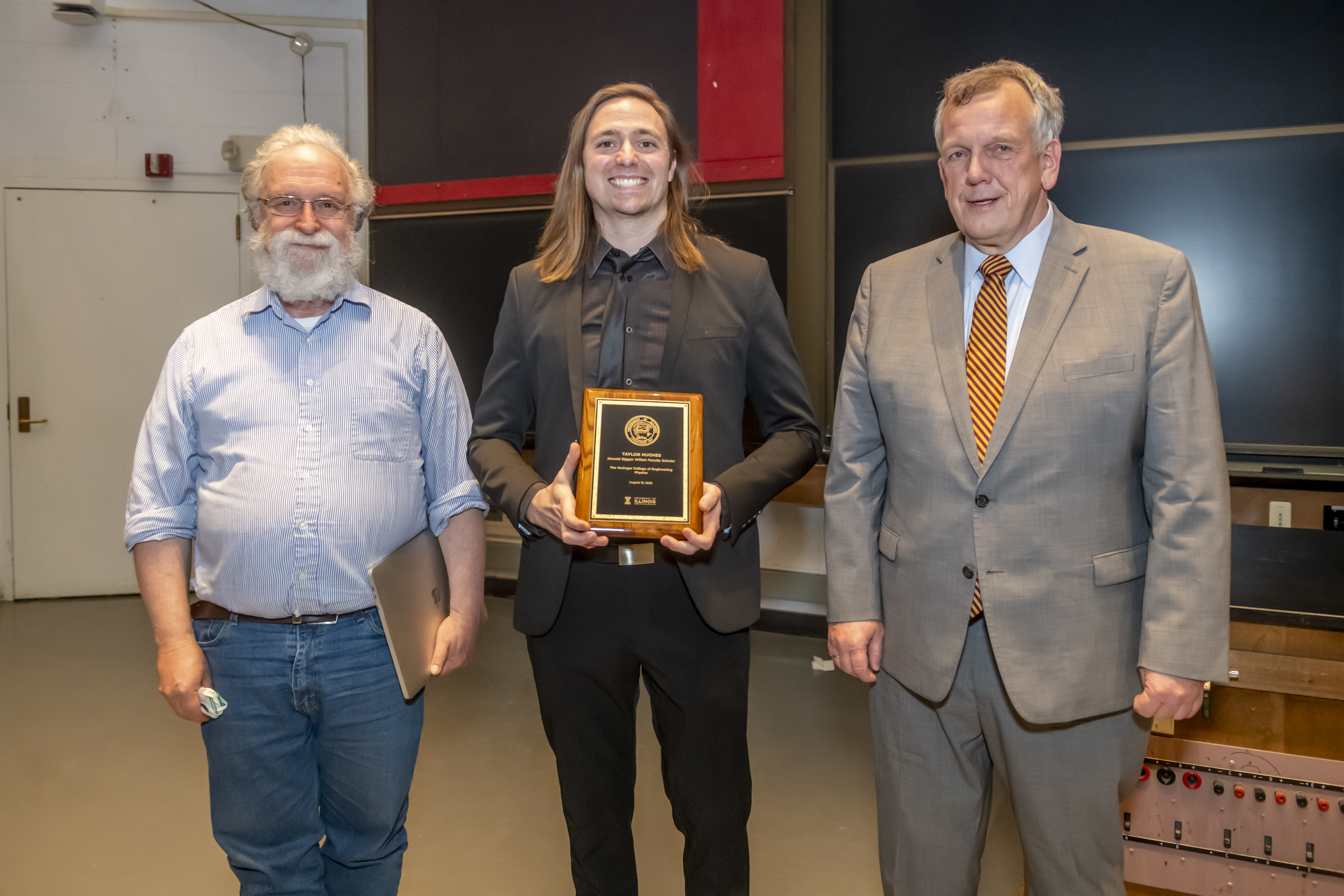 Professor Eduardo Fradkin (left) and Professor and Head Matthias Grosse Perdekamp (right) pose with Professor Taylor Hughes after the ceremony.