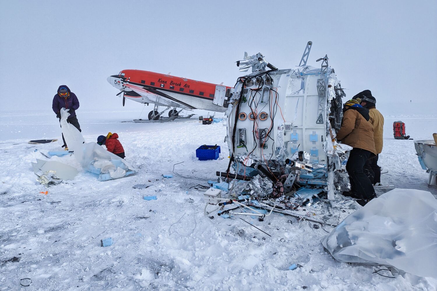 The SPIDER recovery team disassembling the SPIDER payload at its landing site. The payload must be cut into pieces small enough for transport by small aircraft to the South Pole Station. Photo by Scott Battaion, CSBF