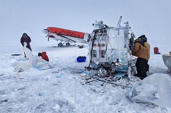 The SPIDER recovery team disassembling the SPIDER payload at its landing site. The payload must be cut into pieces small enough for transport by small aircraft to the South Pole Station. Photo by Scott Battaion, CSBF