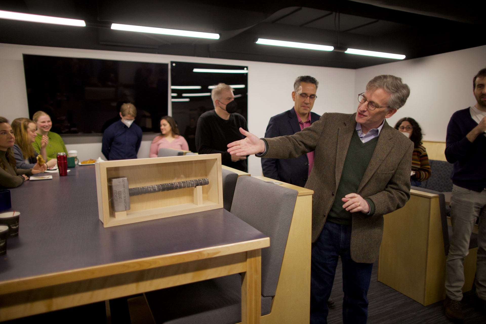 Illinois Physics and Astronomy Professor Charles Gammie presents the ICASU ceremonial hammer, which was made in the machine shop in Loomis. The latin inscription reads &amp;amp;amp;amp;amp;amp;amp;ldquo;Percutite id cum malleo,&amp;amp;amp;amp;amp;amp;amp;rdquo; or &amp;amp;amp;amp;amp;amp;quot;Hit it with a hammer.&amp;amp;amp;amp;amp;amp;quot;