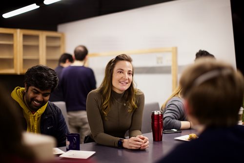 Postdoctoral researcher Alexandria Tucker (center) shares a laugh with graduate student Pratik Wagle and other ICASU students. Photo credit: Joaquin Vieira.
