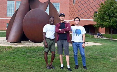 Pictured left to right, Illinois Physics Professor Philip Phillips poses with graduate student Jinchao Zhao and postdoctoral researcher Peizhi Mai on the Bardeen Quad on the Urbana campus. Photo by Siv Schwink, Illinois Physics