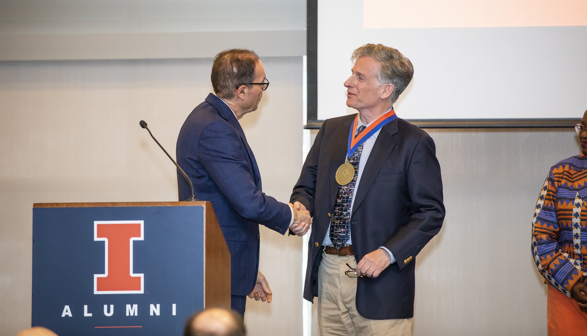 University of Illinois Urbana-Champaign Provost John Coleman presents Physics and Astronomy Professor Charles Gammie with a medal on the occasion of his investiture as the Ikenberry Endowed Chair.