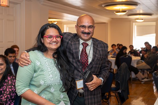Illinois Physics graduate student Shraddha Agrawal, a recipient of the 2024 Dr. Frank Lederman Award, takes a moment to embrace her father visiting from India during the awards ceremony.