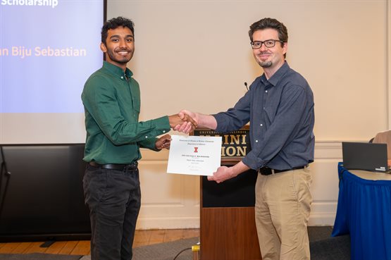 Illinois Physics undergraduate student Ryan Sebastian receives the 2024 Lewis C. Hack Scholarship, presented by Associate Head for Undergraduate Programs Yann Chemla.