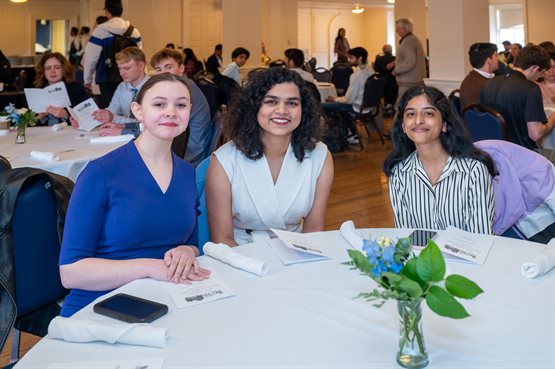 Illinois Physics Undergraduate Student Prerana Singh, a recipient of the 2024 Lorella M. Jones Summer Research Award, sits with her guests during the student awards banquet.