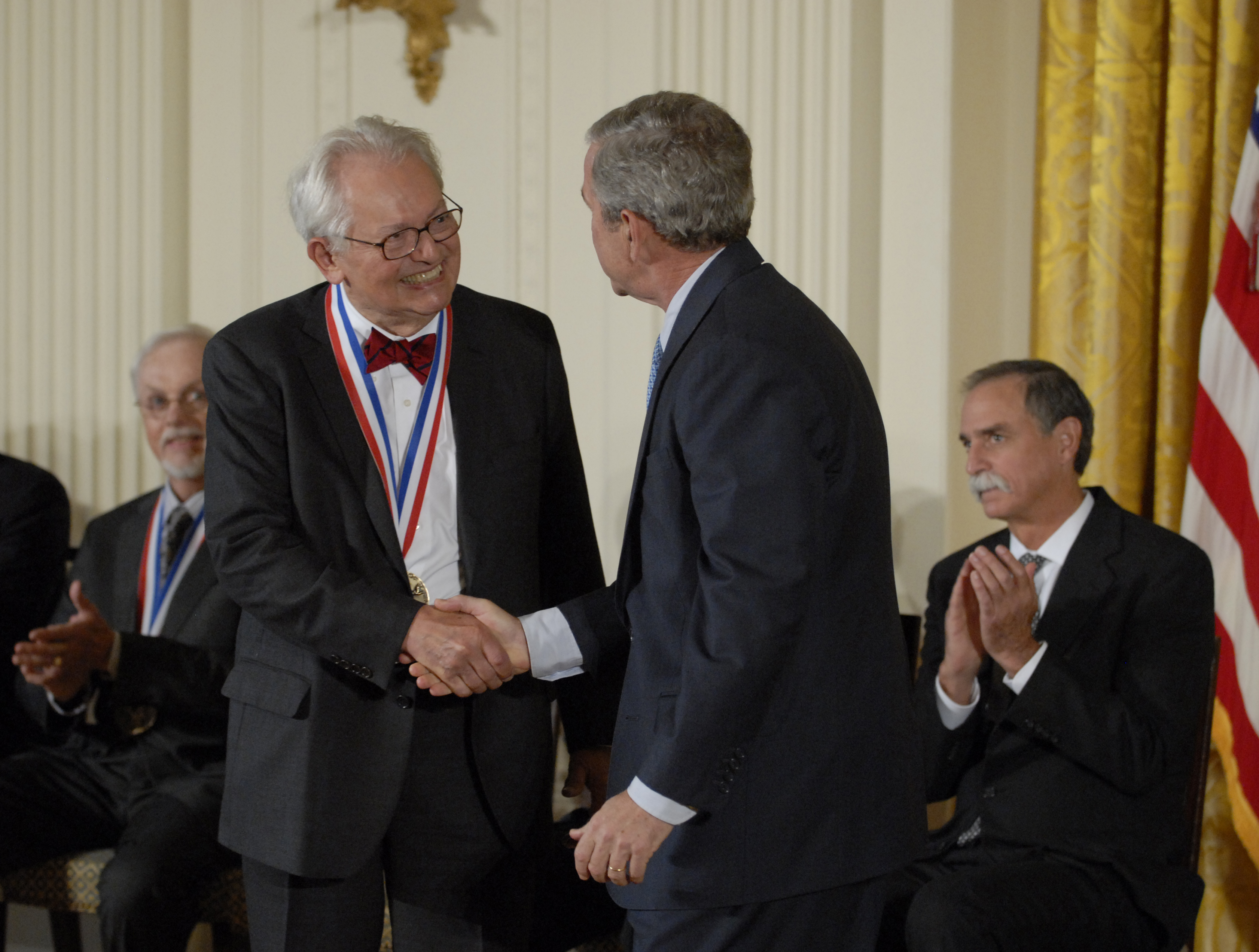 Charles Slichter shaking President George W. Bush's hand.