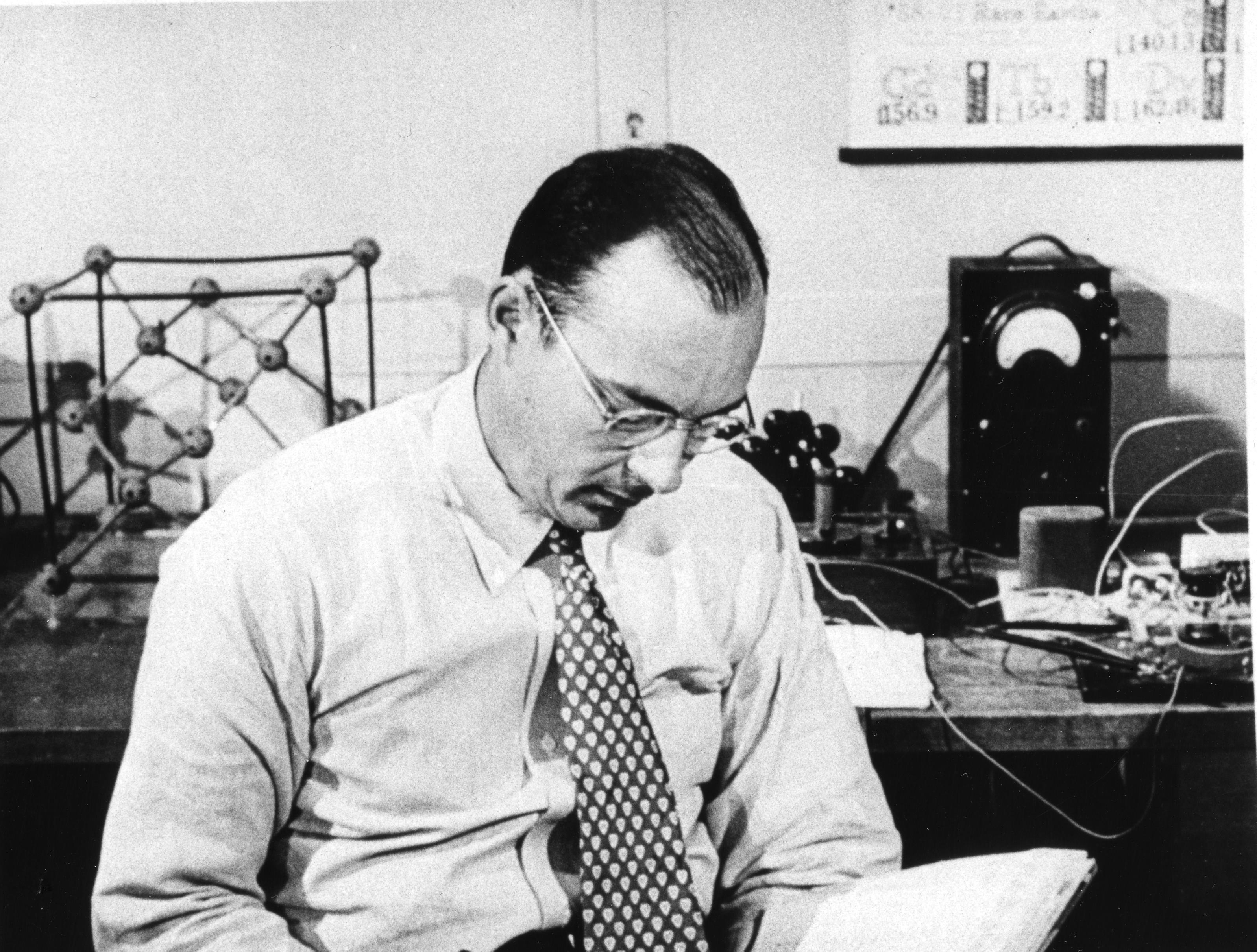 John Bardeen sitting in a laboratory reading, ca. 1950s