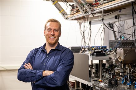 Illinois Physics Professor Jacob Covey poses in his laboratory at the Illinois Quantum Information Science and Technology Center (IQUIST) in the Engineering Sciences Building.